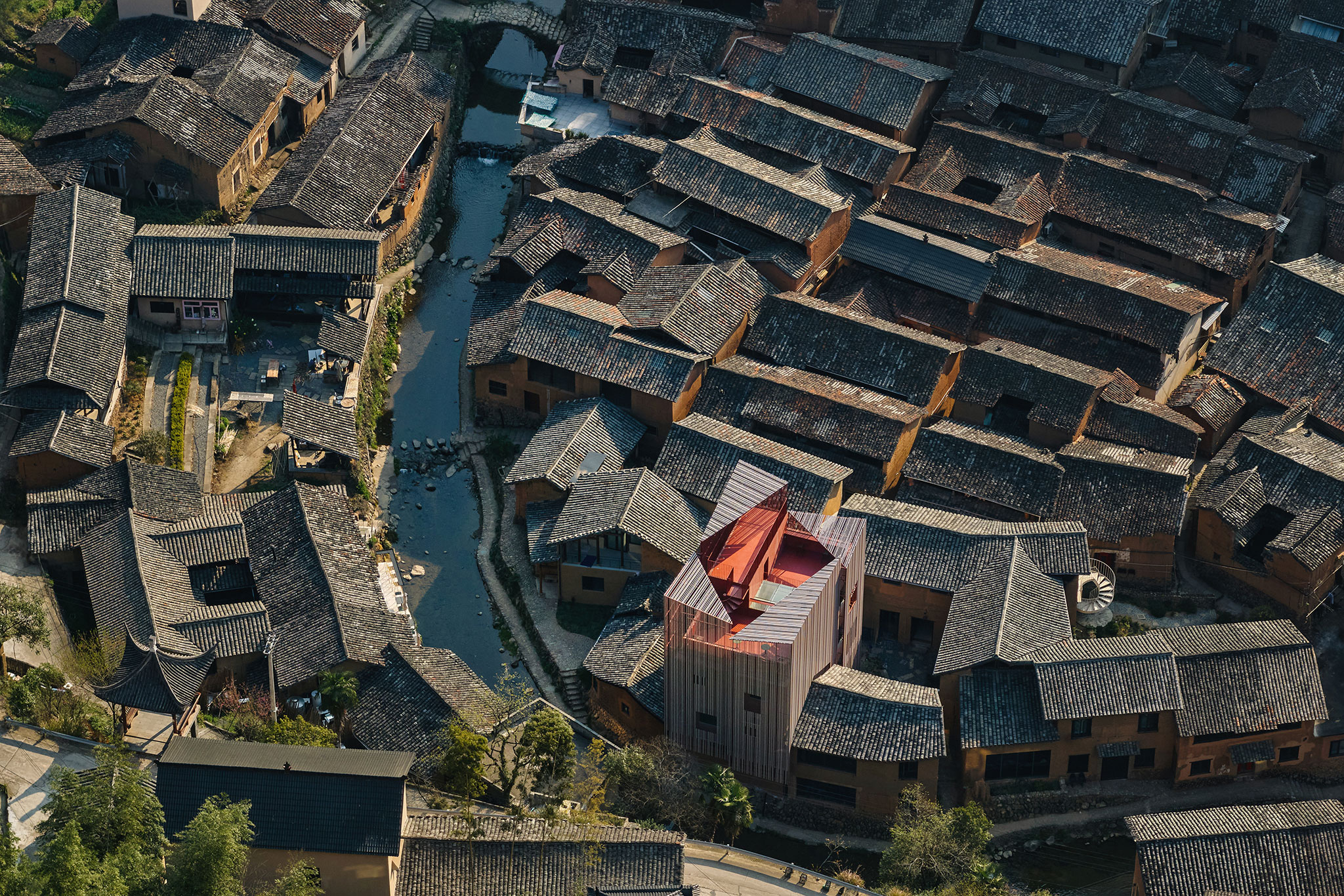 One divided into four volumes is closer to the scale of the village. Songzhuang Z Museum by TEAM_BLDG. Photograph by Jonathan Leijonhufvud.