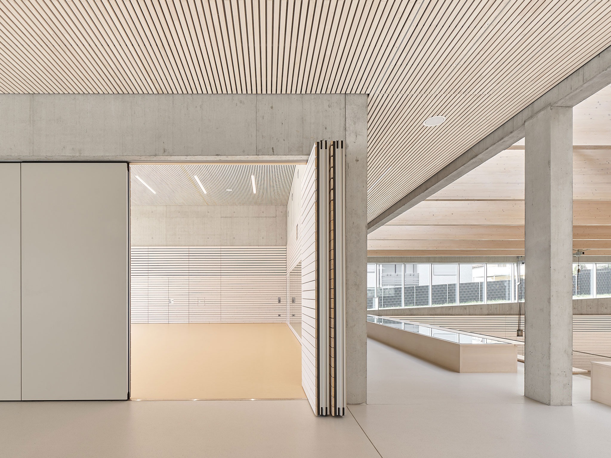 Three-pitch sports hall by Drei Architekten. Photograph by Zooey Braun. Three-pitch sports hall by Drei Architekten. Photograph by Zooey Braun.
