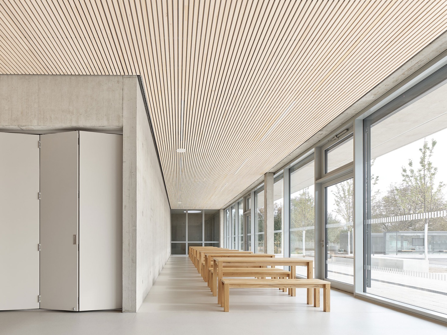 Three-pitch sports hall by Drei Architekten. Photograph by Zooey Braun.