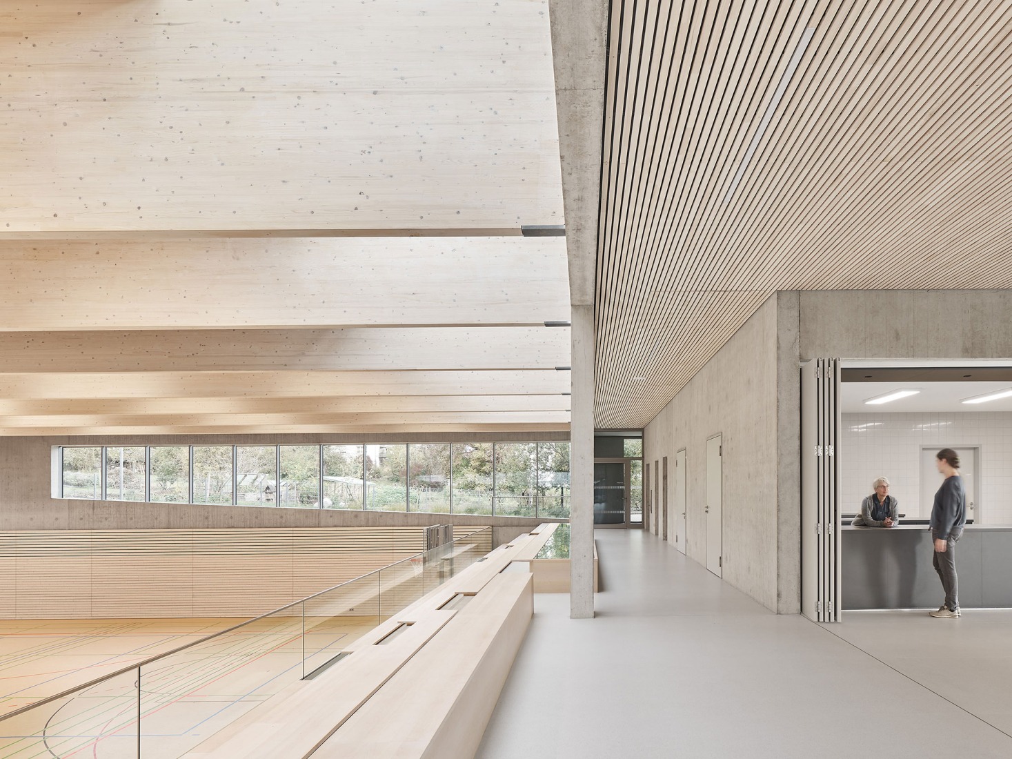Three-pitch sports hall by Drei Architekten. Photograph by Zooey Braun.