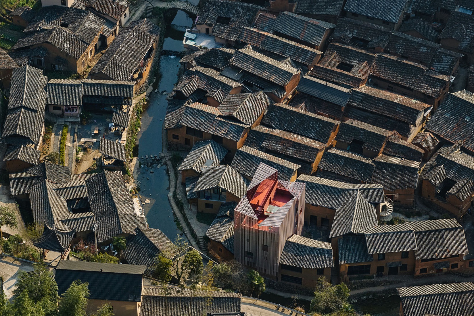 One divided into four volumes is closer to the scale of the village. Songzhuang Z Museum by Team_BLDG. Photograph by Jonathan Leijonhufvud.