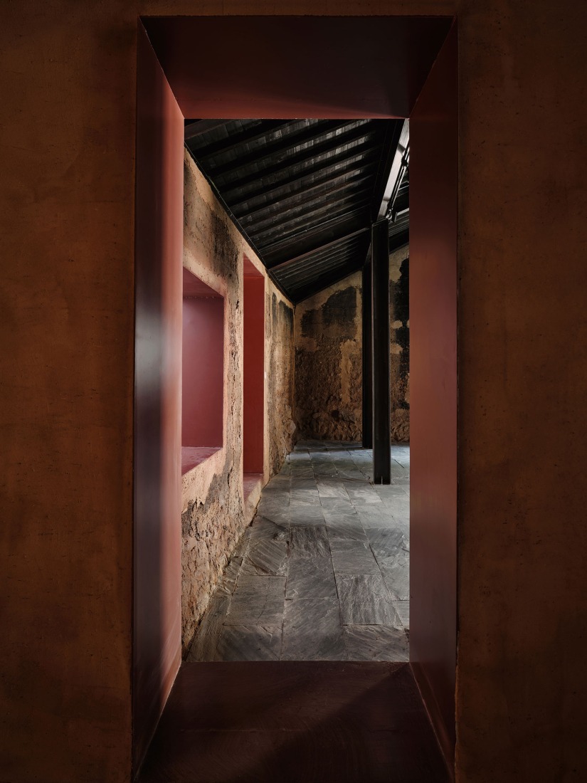 The red tube serves as the connection between the new and old. Songzhuang Z Museum by Team_BLDG. Photograph by Jonathan Leijonhufvud.