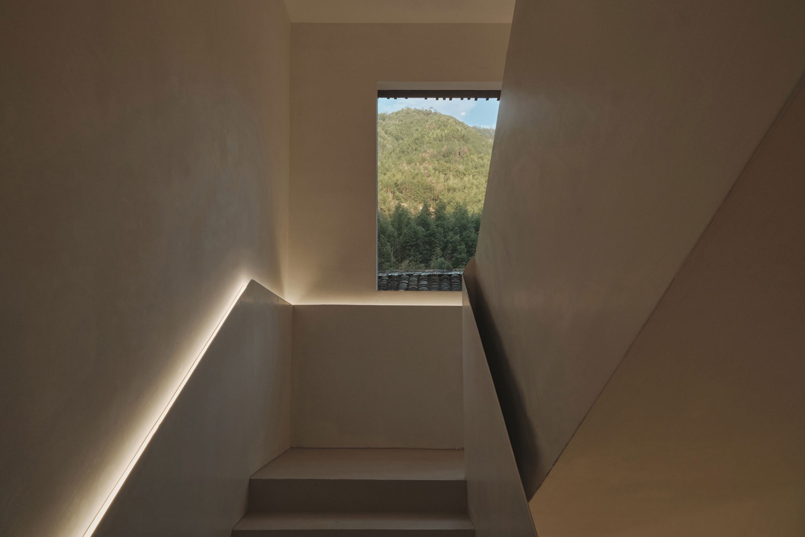As you ascend the steps, nature surges toward you in a breath-taking embrace. Songzhuang Z Museum by Team_BLDG. Photograph by Jonathan Leijonhufvud.