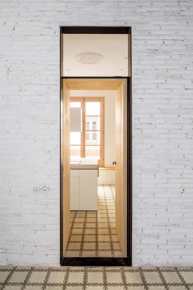 Renovation of 8 homes by Agora Arquitectura. Photograph by Adrià Goulà