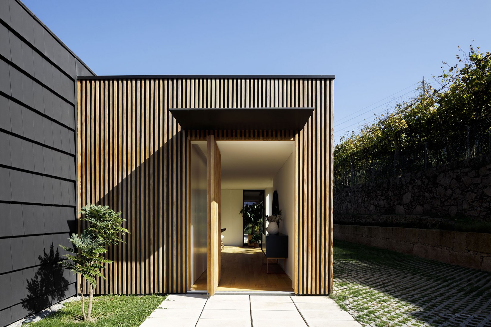 Santo Tirso House by Hous3. Photograph by Ivo Tavares Studio