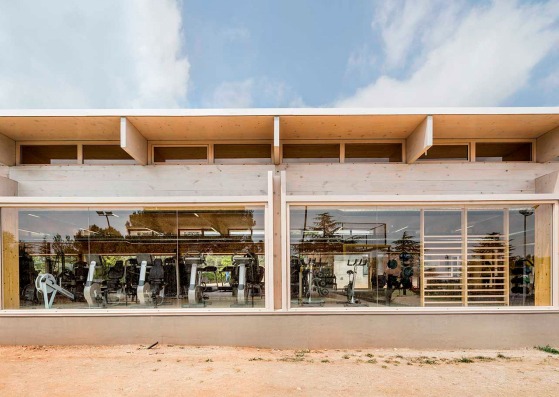 New ATHC Gym-Fitness Room Annex Building by BAMMP Arquitectos and XVA Arquitectura. Photograph by Adrià Goula