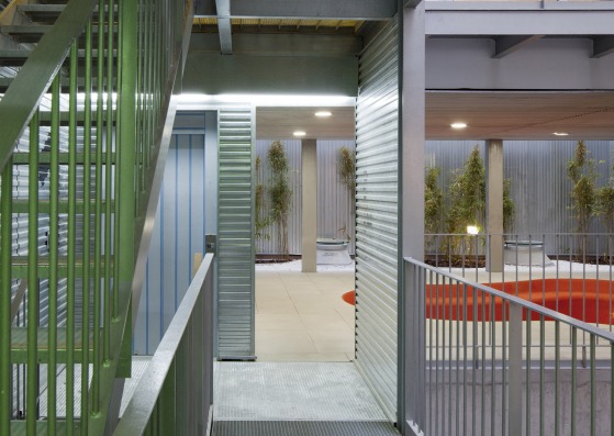 Housing complex in Lavapiés by Ciria Álvarez Arquitectos. Image of the interior common spaces around the patio concept. Photograph © Miguel de Guzmán / Imagen Subliminal