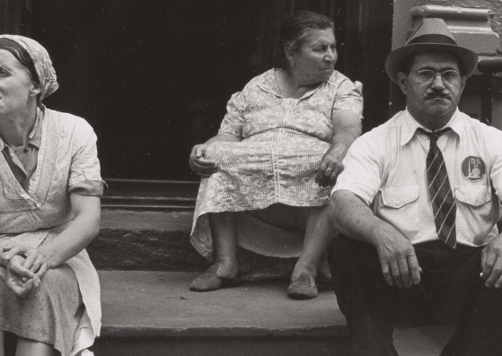Three figures on a stoop, New York City, by Helen Levitt (1939)