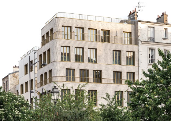 14 social housing units and a nursery in Paris by NZI Architectes. Photograph by Simon Guesdon