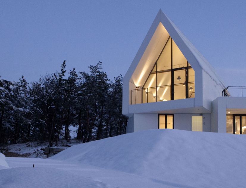 House [in white] by AEV Architectures. Photograph by Hyunjune Lee