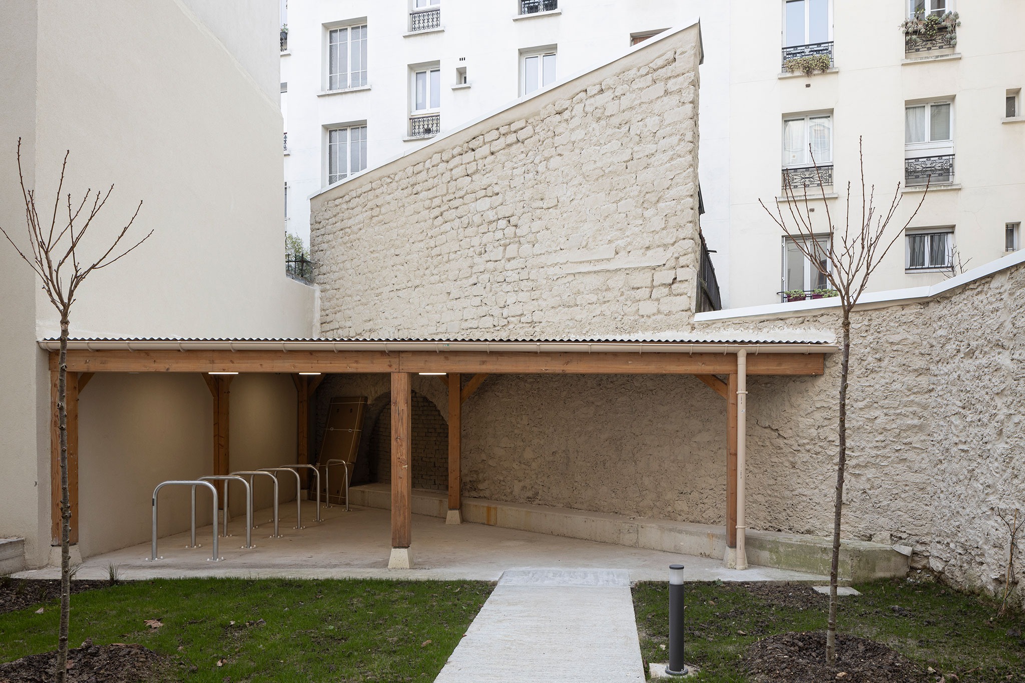 15 housing units in solid stone, timber and hemp concrete by MAO Architectes. Photograph by Cyrille Lallement. 15 housing units in solid stone, timber and hemp concrete by MAO Architectes. Photograph by Cyrille Lallement.