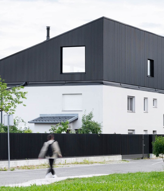 Attic reimagined extension by Arhitektura. Photograph by Miran Kambič