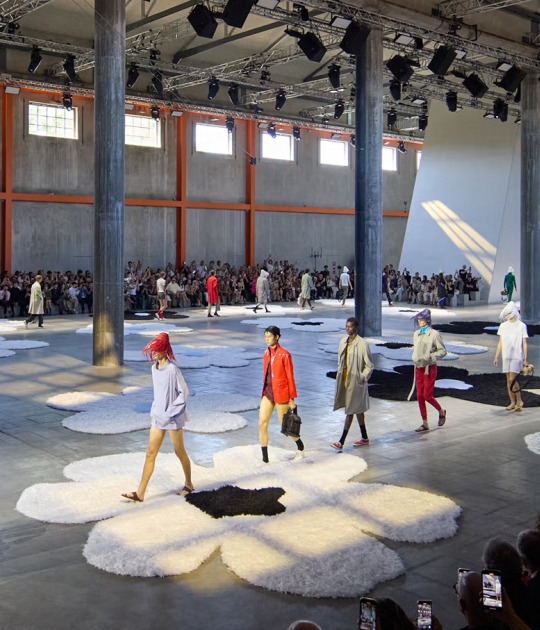 Prada’s show set at Milan Fashion Week S/S 2026, with the Deposito space at Fondazione Prada windows opened, allowing light in. Photograph courtesy of Prada
