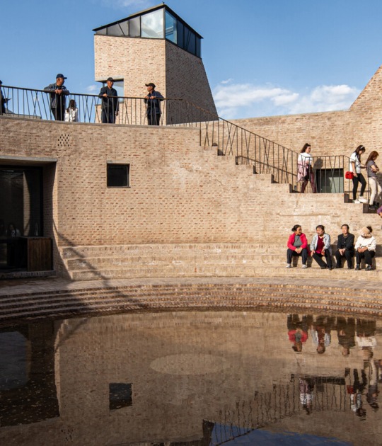 View of the interior courtyard where water has formed a reflecting pool. Photograph courtesy by Aga Khan Trust for Culture / Dou Yujun (photographer).