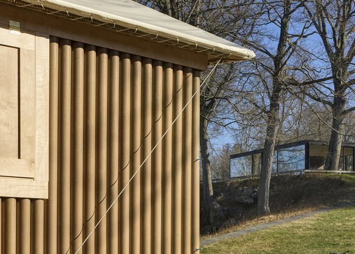Paper Log House by Shigeru Ban face to Philip Johnson's Glass House