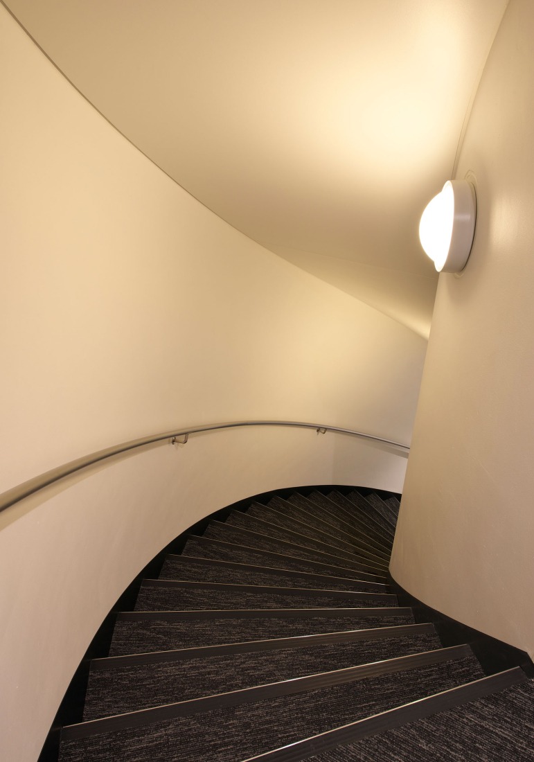 Kenzo Tange's Shizuoka Press and Broadcasting Center, renovated by TAISEI. Standard floor Stairs. Photograph by Naoki Kumagai Photo Office, Inc.