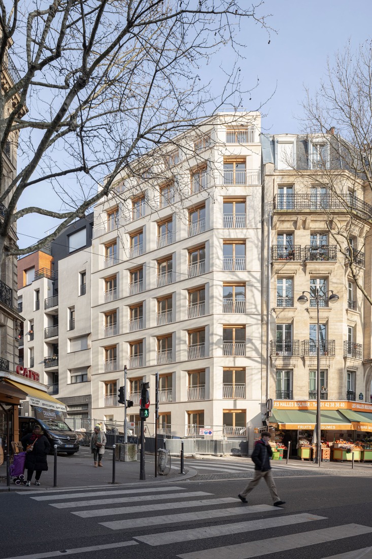 15 housing units in solid stone, timber and hemp concrete by MAO Architectes. Photograph by Cyrille Lallement.