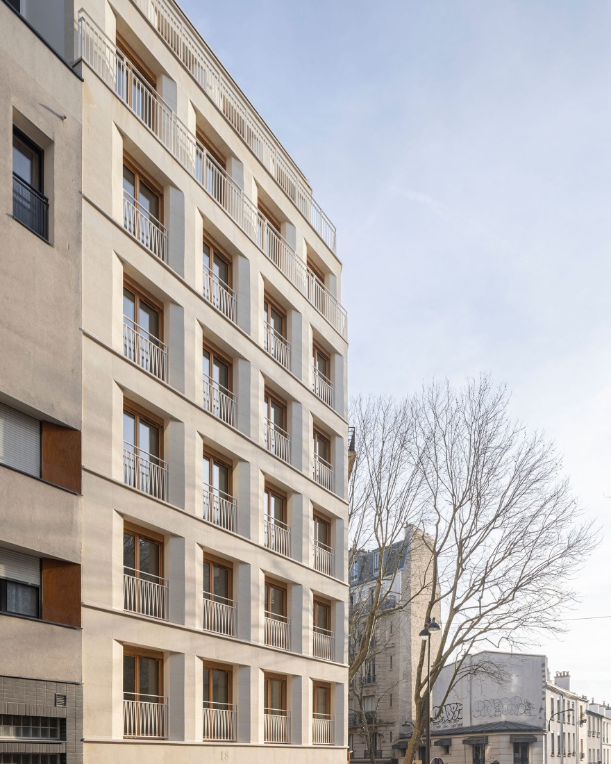 15 housing units in solid stone, timber and hemp concrete by MAO Architectes. Photograph by Cyrille Lallement.