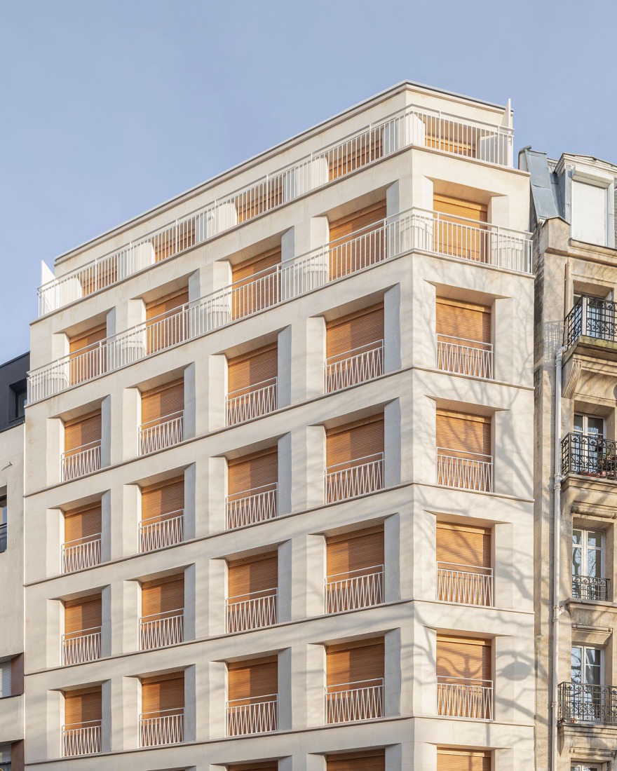 15 housing units in solid stone, timber and hemp concrete by MAO Architectes. Photograph by Cyrille Lallement.