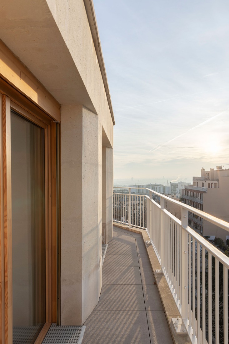 15 housing units in solid stone, timber and hemp concrete by MAO Architectes. Photograph by Cyrille Lallement.