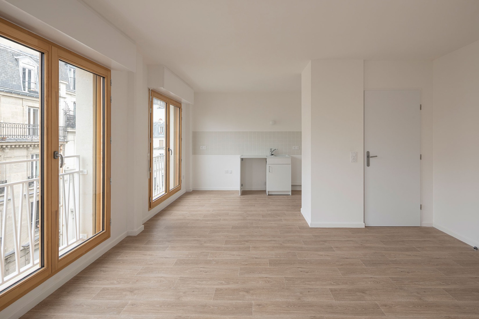 15 housing units in solid stone, timber and hemp concrete by MAO Architectes. Photograph by Cyrille Lallement.