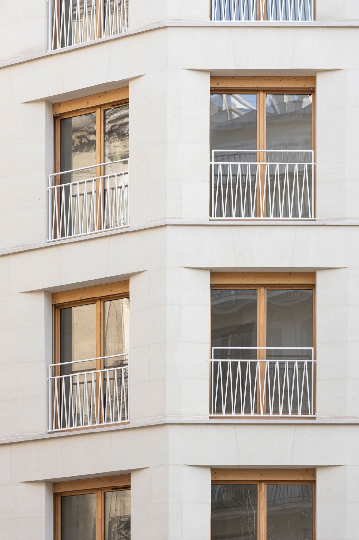 15 housing units in solid stone, timber and hemp concrete by MAO Architectes. Photograph by Cyrille Lallement.