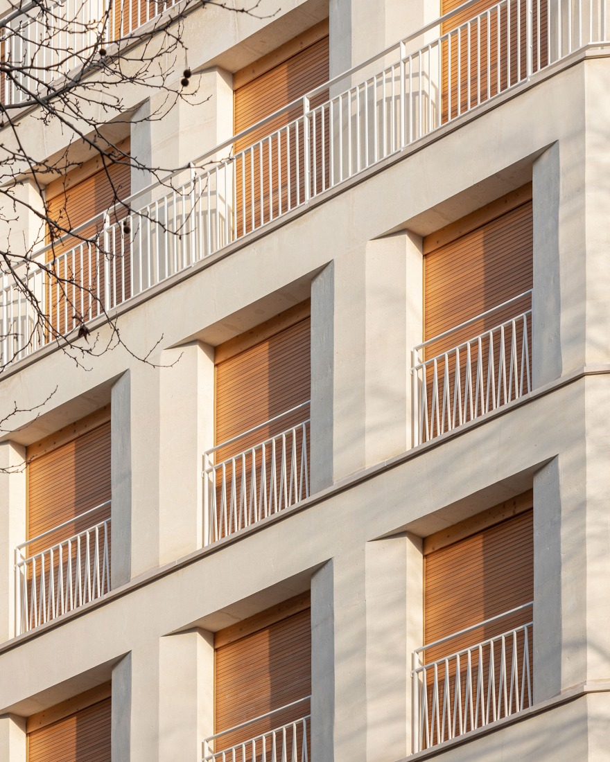 15 housing units in solid stone, timber and hemp concrete by MAO Architectes. Photograph by Cyrille Lallement.