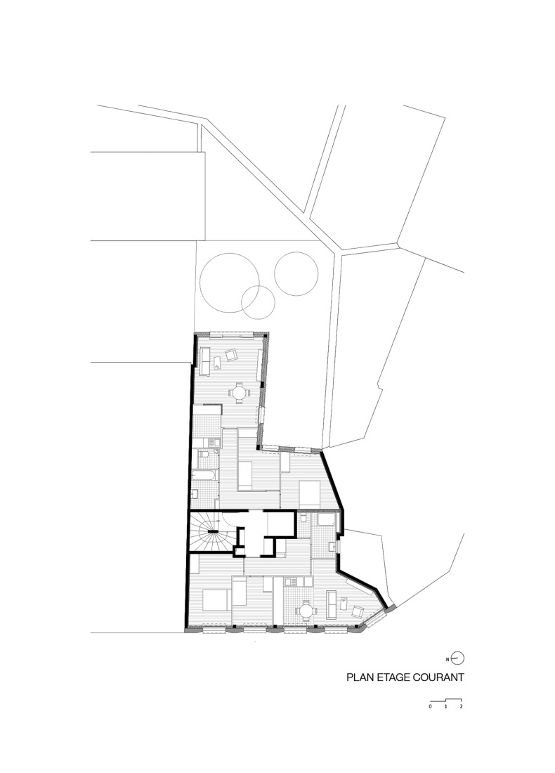 First floor plan. 15 housing units in solid stone, timber and hemp concrete by MAO Architectes.