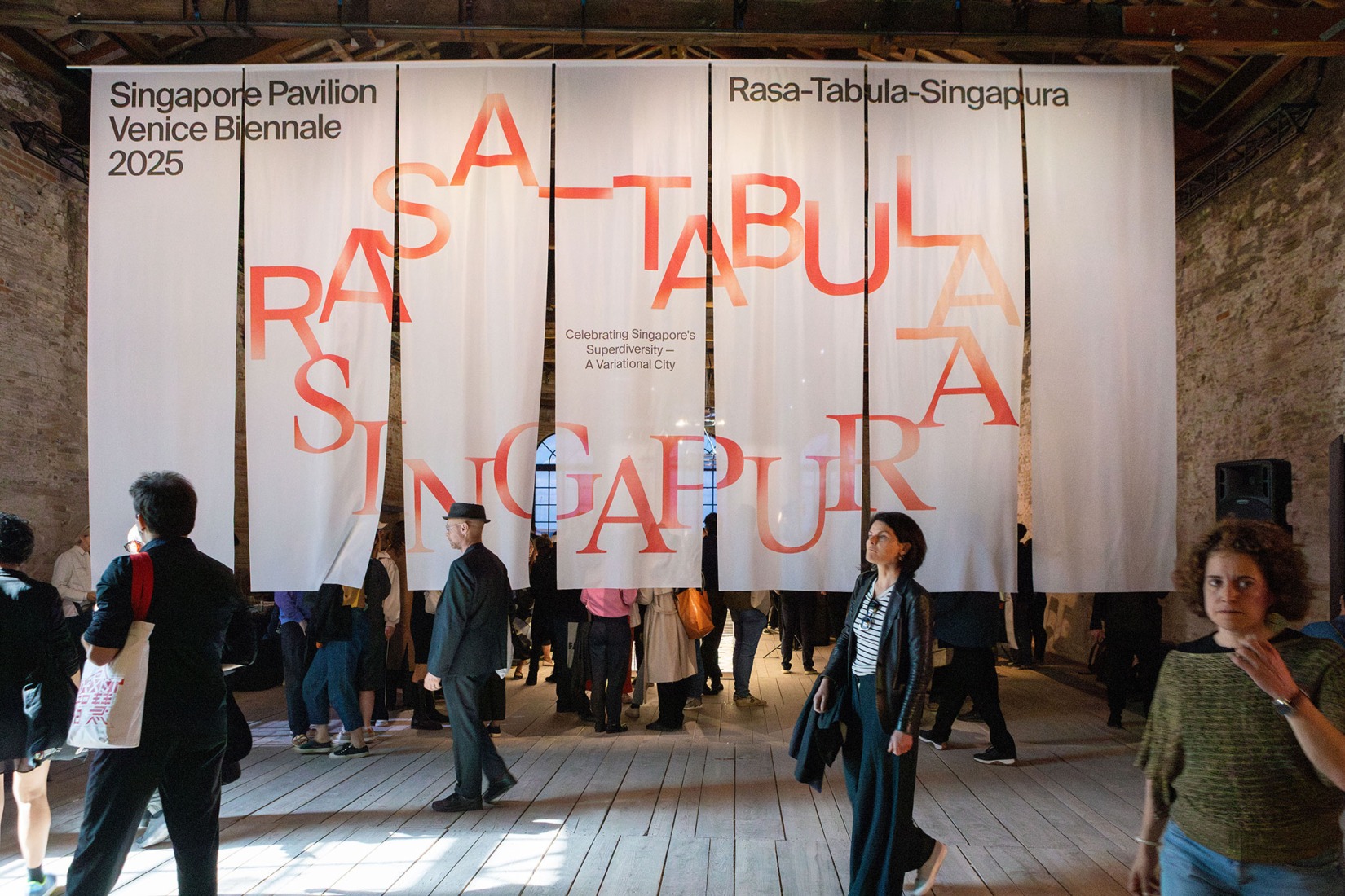 Visitors in the welcome area of the Singapore Pavilion, located at the Arsenale, Venice, as part of the 19th International Architecture Exhibition – La Biennale di Venezia. Photograph by Giulio Boem.