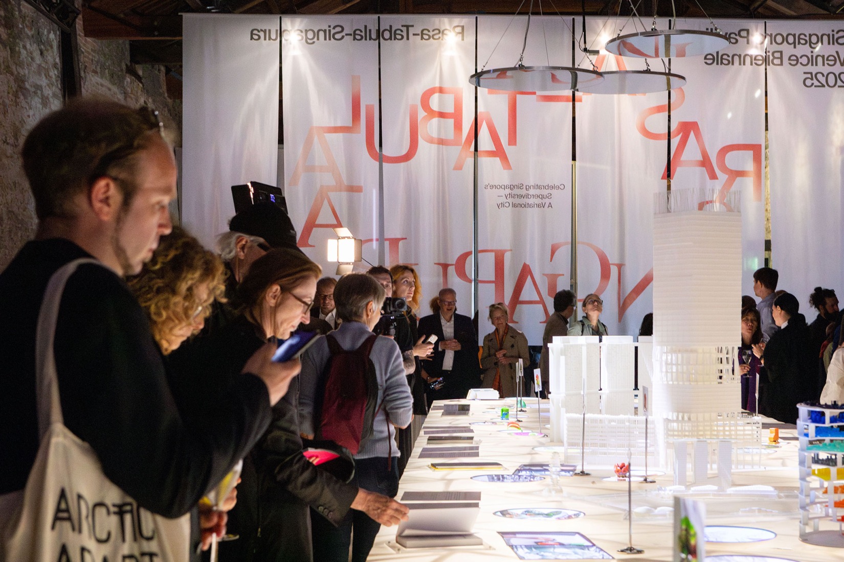 International visitors taking in the exhibition "Rasa-Tabula-Singapura" at the Singapore Pavilion, located at the Arsenale in Venice, as part of the 19th International Architecture Exhibition – La Biennale di Venezia. Photograph by Giulio Boem.