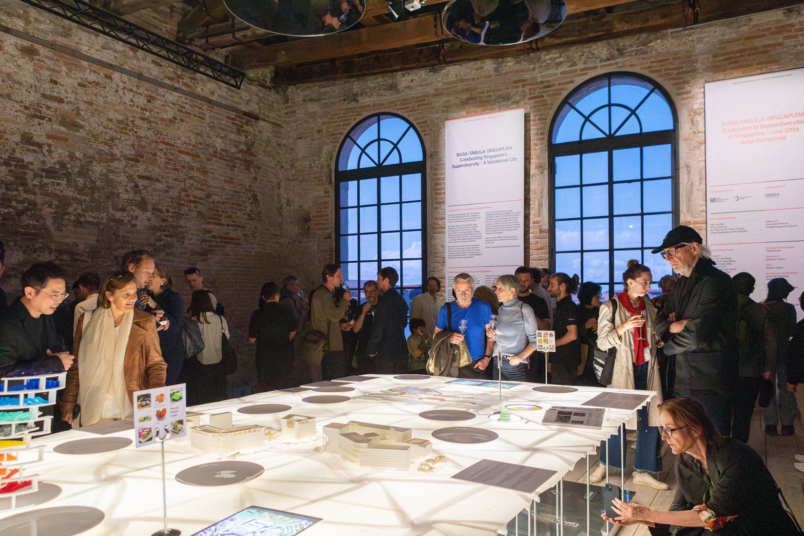 International visitors taking in the exhibition "Rasa-Tabula-Singapura" at the Singapore Pavilion, located at the Arsenale in Venice, as part of the 19th International Architecture Exhibition – La Biennale di Venezia. Photograph by Giulio Boem.