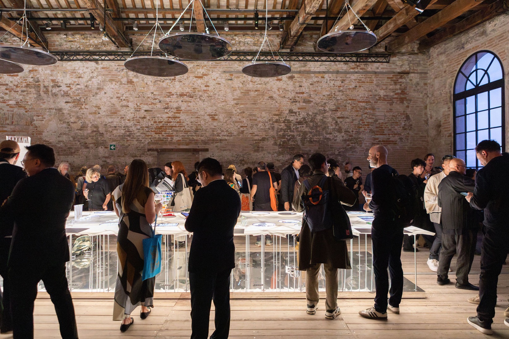 International visitors taking in the exhibition "Rasa-Tabula-Singapura" at the Singapore Pavilion, located at the Arsenale in Venice, as part of the 19th International Architecture Exhibition – La Biennale di Venezia. Photograph by Giulio Boem.