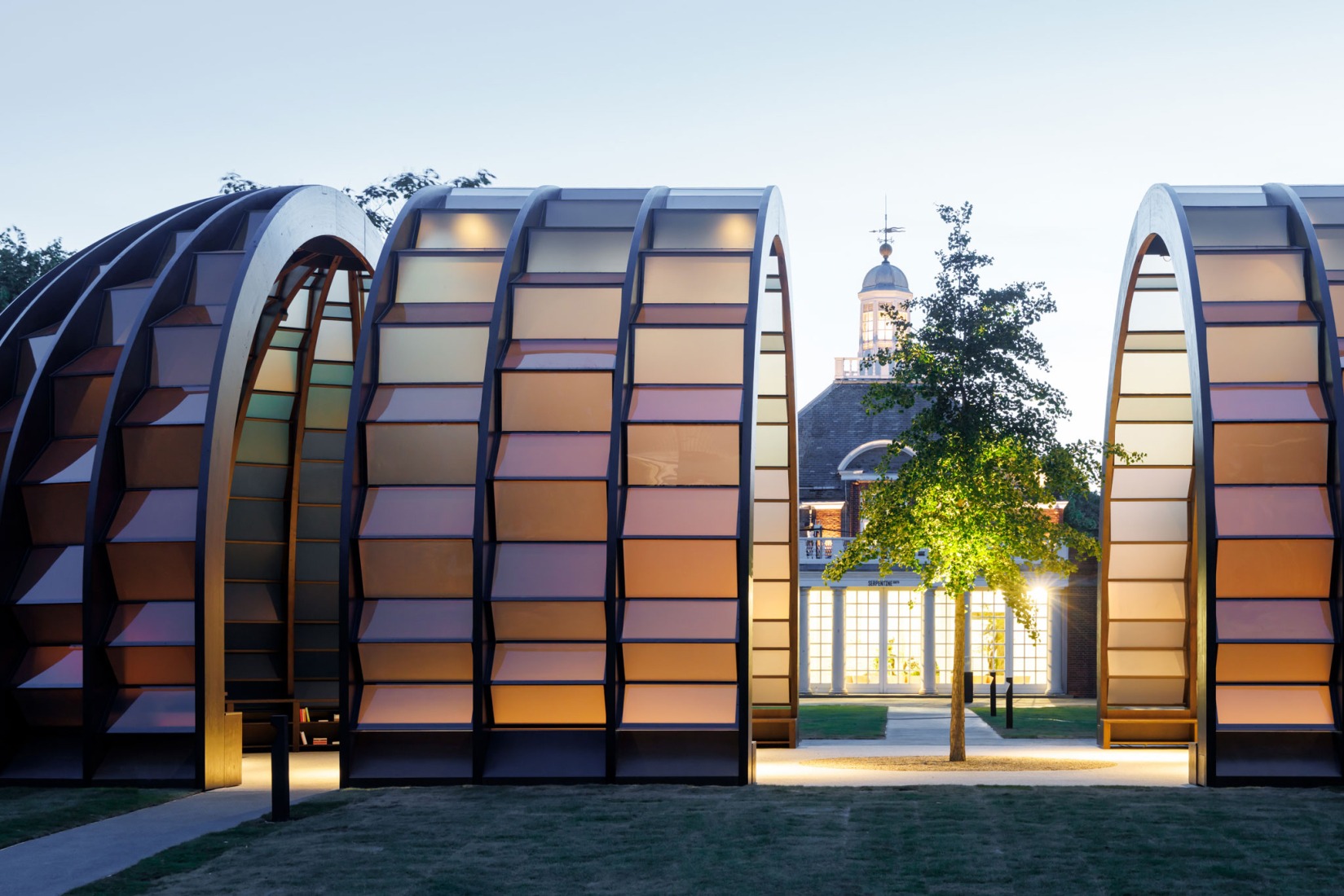Exterior view. Serpentine Pavilion 2025. A Capsule in Time, by Marina Tabassum, Marina Tabassum Architects (MTA). Photograph by Iwan Baan. Courtesy of Serpentine.
