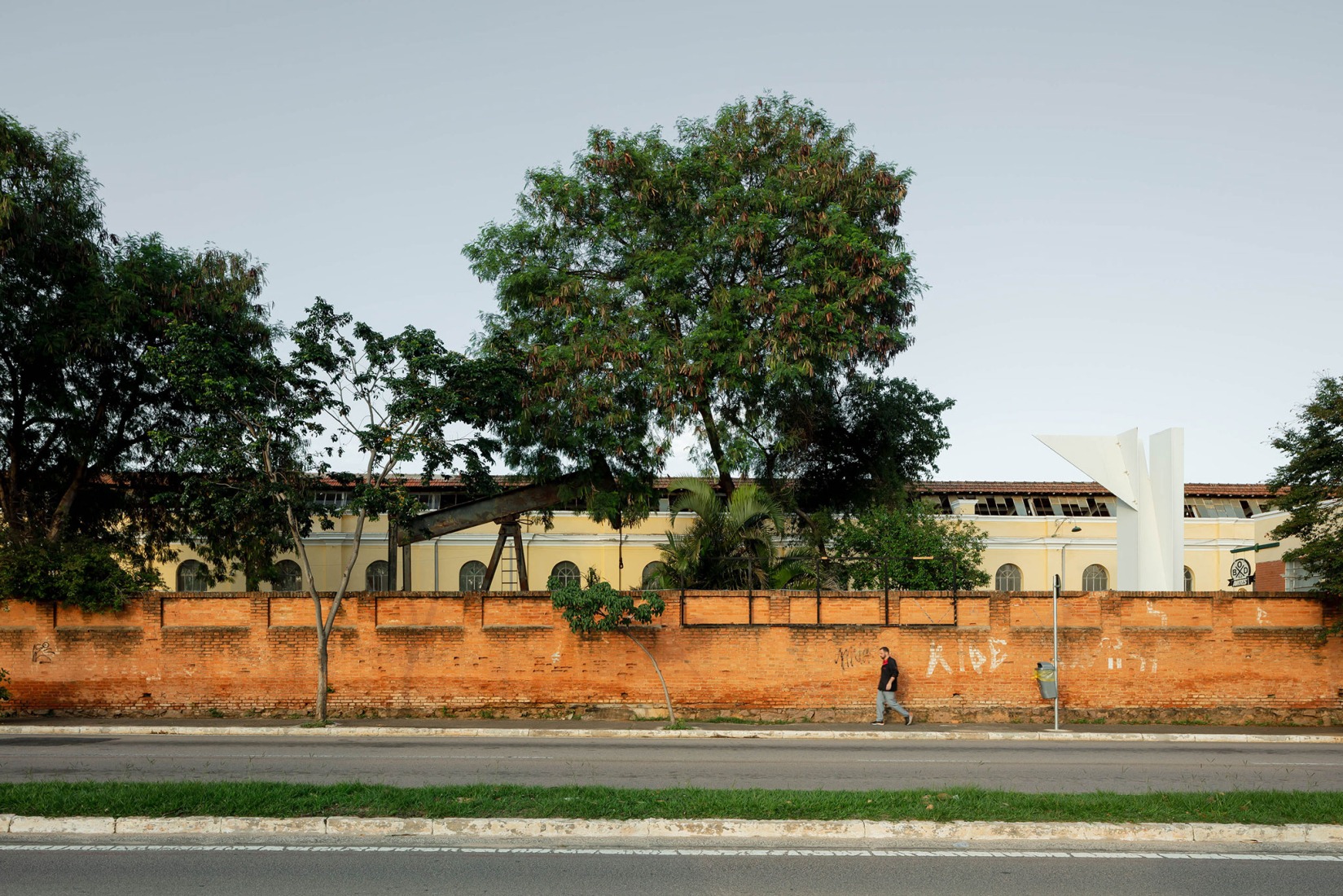  Street view of the Building A, still untouched. Fábrica de Arte Marcos Amaro (FAMA) by KAAN. Photograph by Sebastian van Damme.