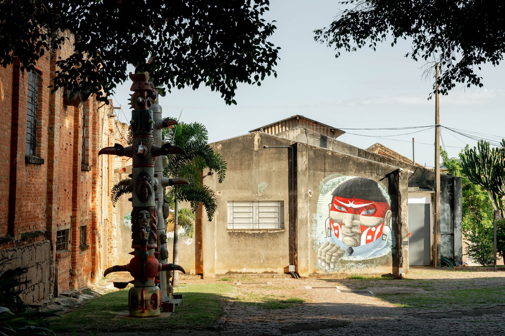 View of the façades of the Depot F and the Outdoor Exhibition G, featuring Nova tradição (2019–2020) by Nunca Graffiti. Fábrica de Arte Marcos Amaro (FAMA) by KAAN. Photograph by Sebastian van Damme.