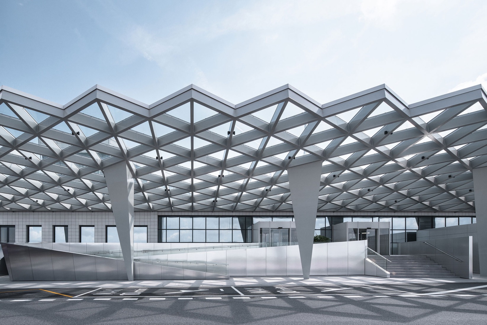 Prague Airport Terminal 3 by ra15. Photograph by Petr Polák.