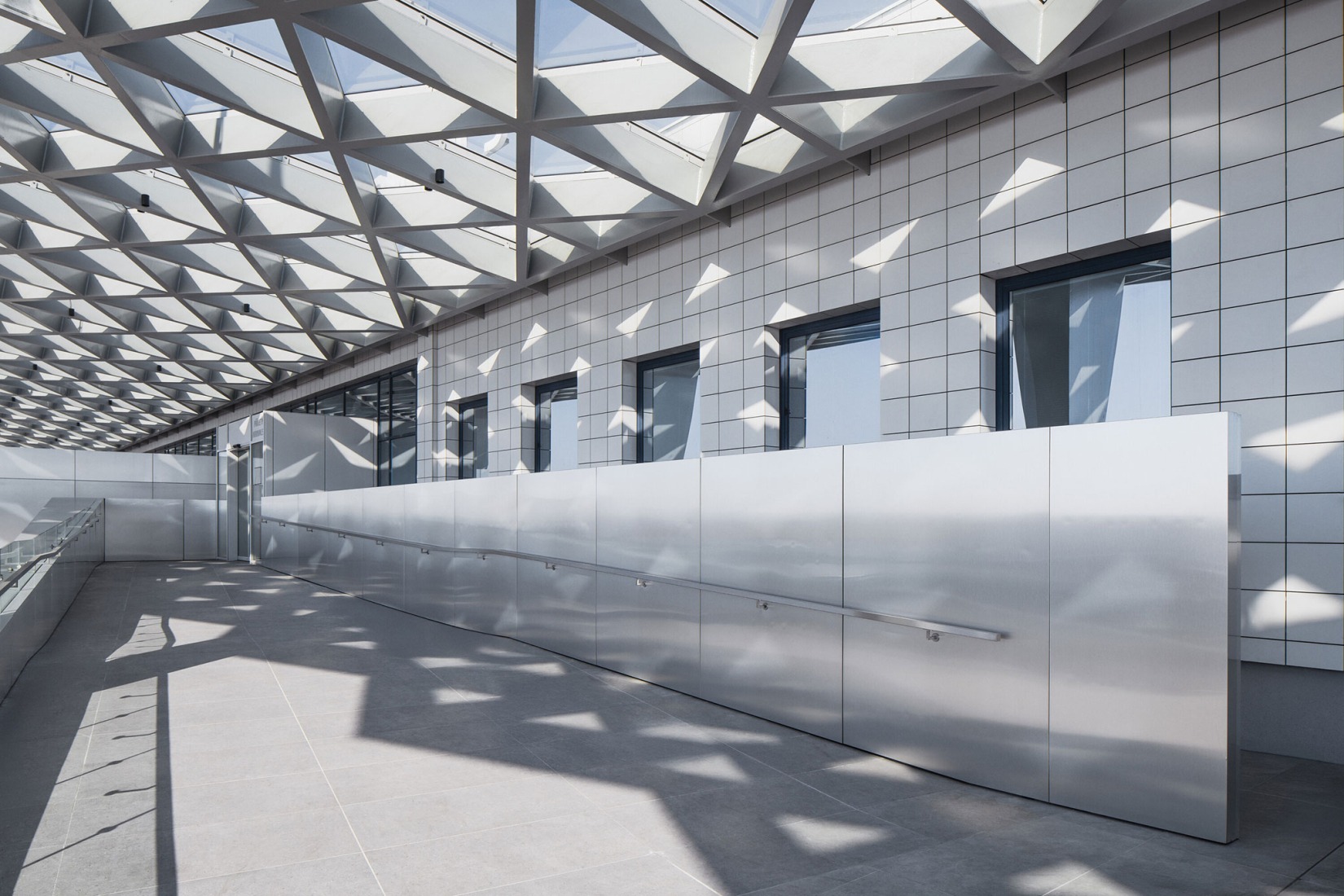 Prague Airport Terminal 3 by ra15. Photograph by Petr Polák.