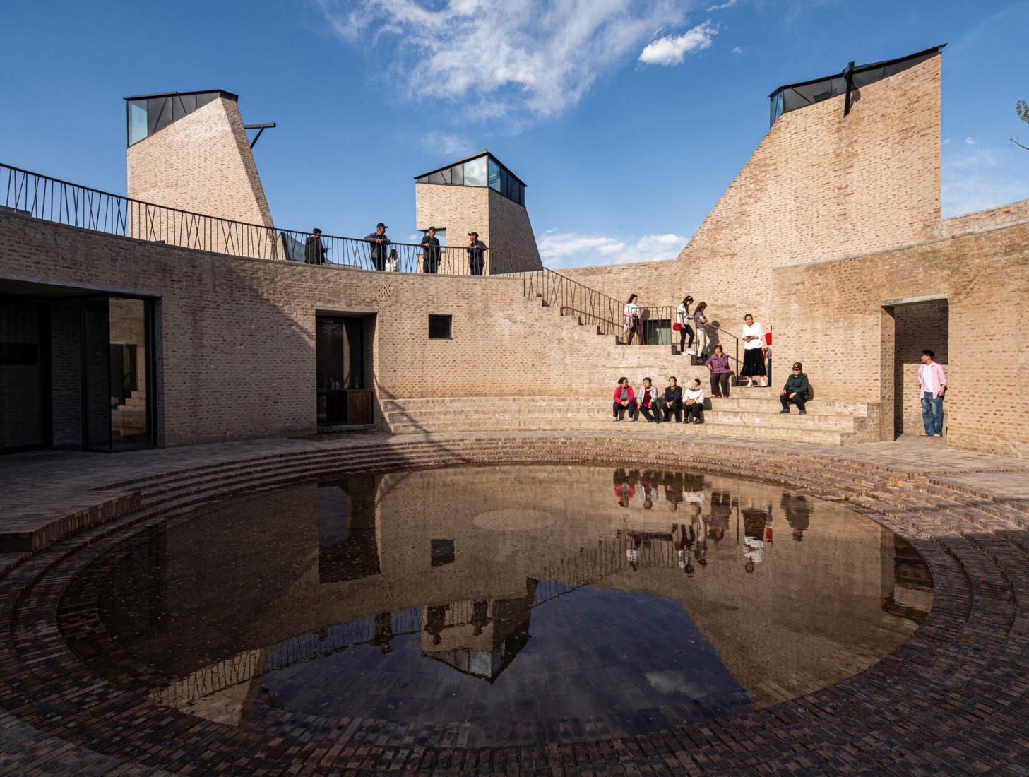 View of the interior courtyard where water has formed a reflecting pool. Photograph courtesy by Aga Khan Trust for Culture / Dou Yujun (photographer).