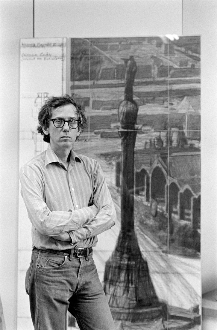 Christo in his studio with a preparatory drawing for Wrapped Monument to Cristobal Colón, New York City, 1984. Photograph by Wolfgang Volz. Courtesy by Christo and Jeanne-Claude Foundation.