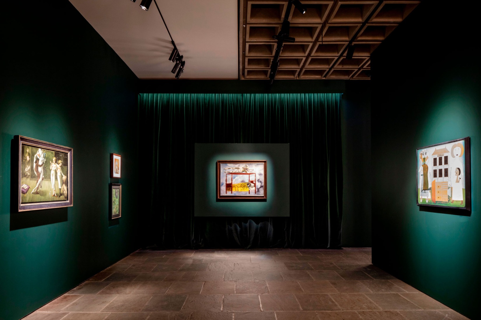 Sotheby’s third-floor Breuer galleries, featuring works from the Modern Evening Auction, highlighted by Dorothea Tanning's Interior with Sudden Joy, Frida Kahlo's El sueño (La cama), and Victor Brauner's Maison hantée [left to right].. Photography by Stefan Ruiz Courtesy of Sotheby’s.