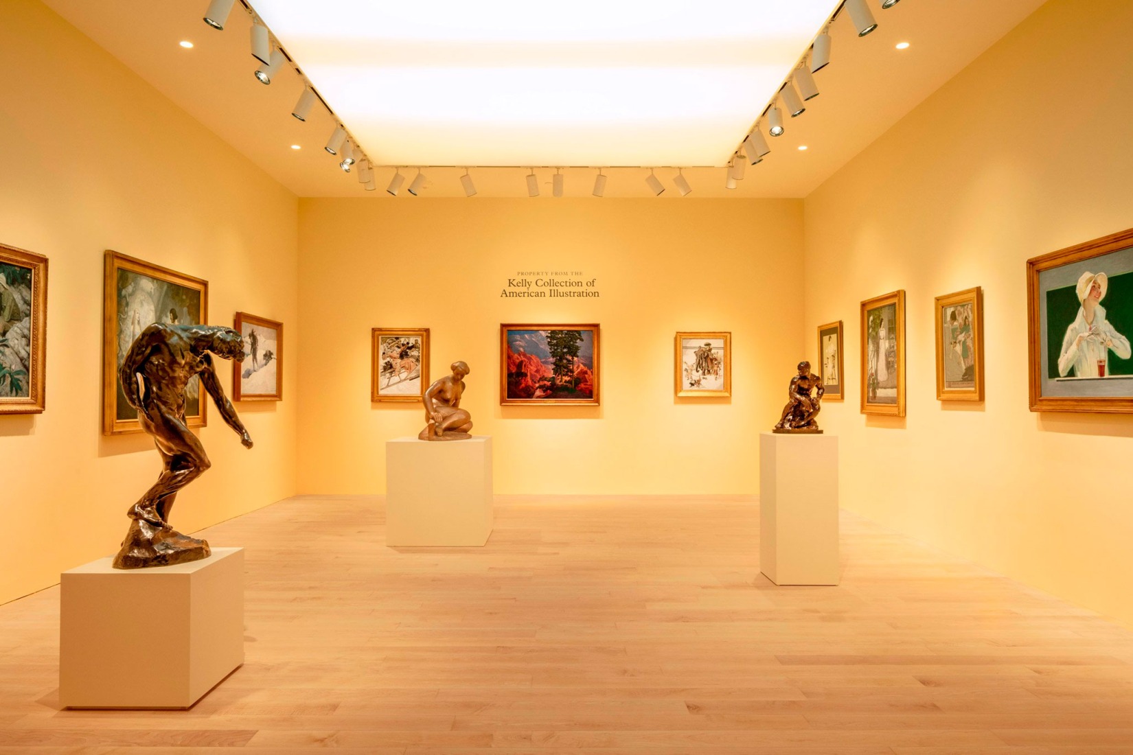 A view of the fifth-floor gallery which includes items from the Kelly Collection of American Illustration, like Auguste Rodin’s L’Ombre, taille originale dite taille de la porte; Raymond Duchamp-Villon’s Young Girl Sitting; and Rodin’s Athlète. Photography by Stefan Ruiz. Courtesy of Sotheby’s.
