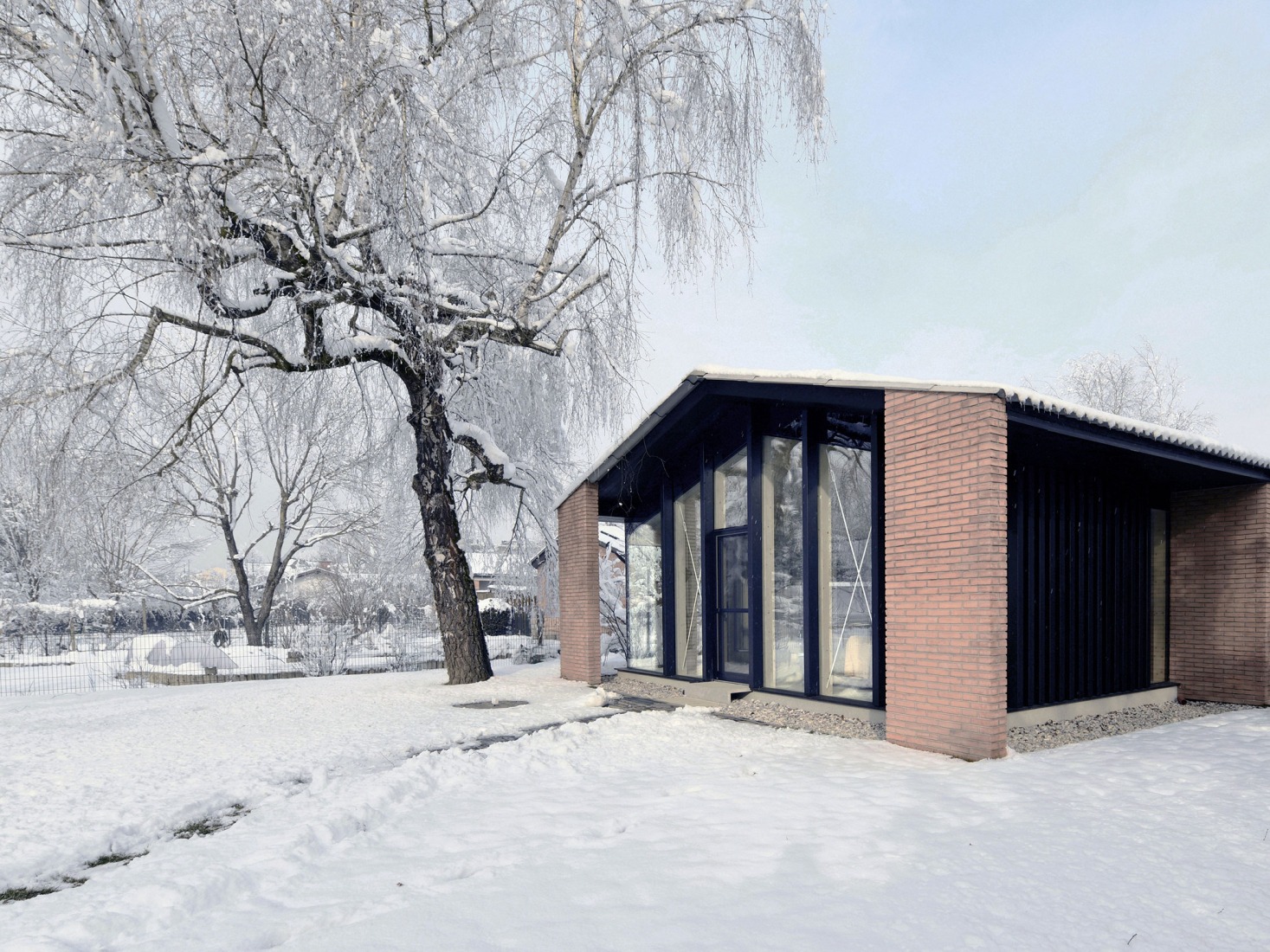 House under the poplars by OFIS arhitekti. Photograph by Tomaž Gregorič. 