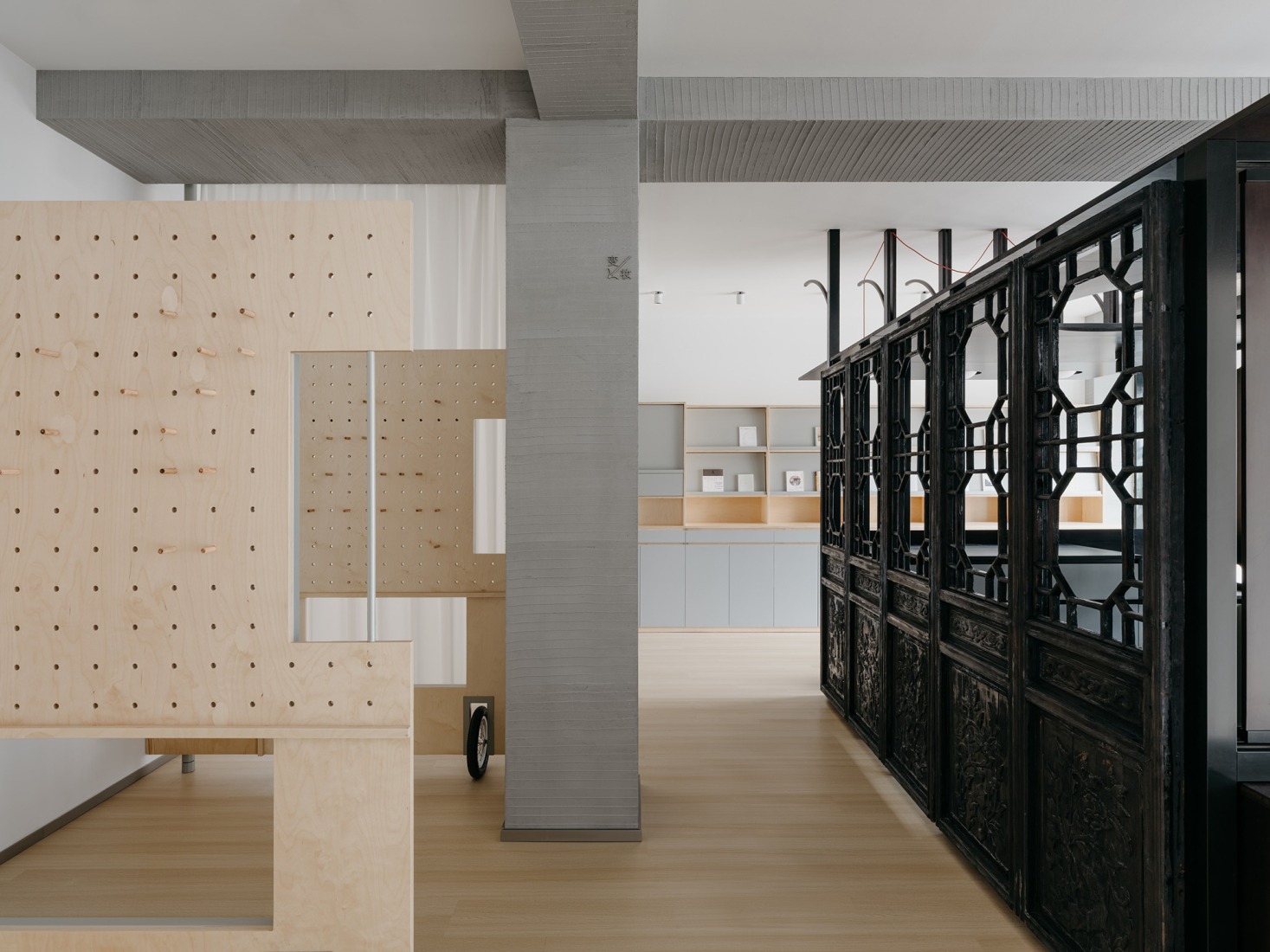 Timber exhibition walls enclose a temporary theater. Baihua Bookstore by Tsing-Tien Making. Photograph by Wen Studio. 