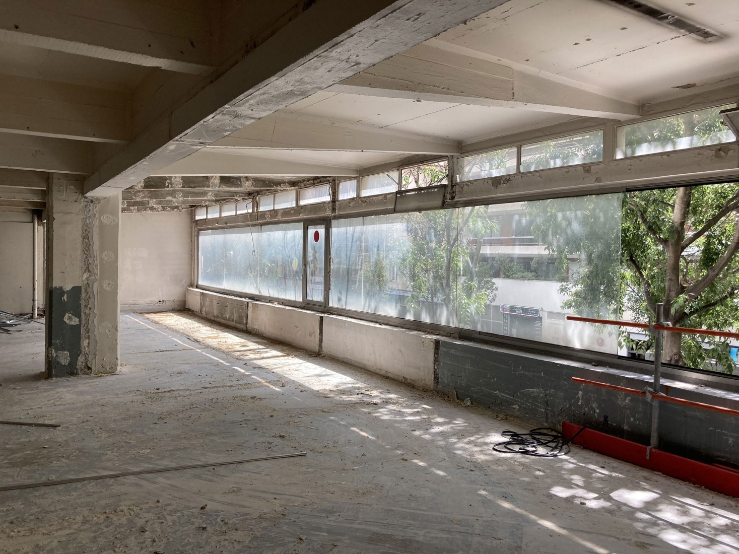 The building prior to its reconstruction from a garage into a 63 Apartment Building, by Atelier Tequi Architects. Photograph by Atelier Tequi Architects.