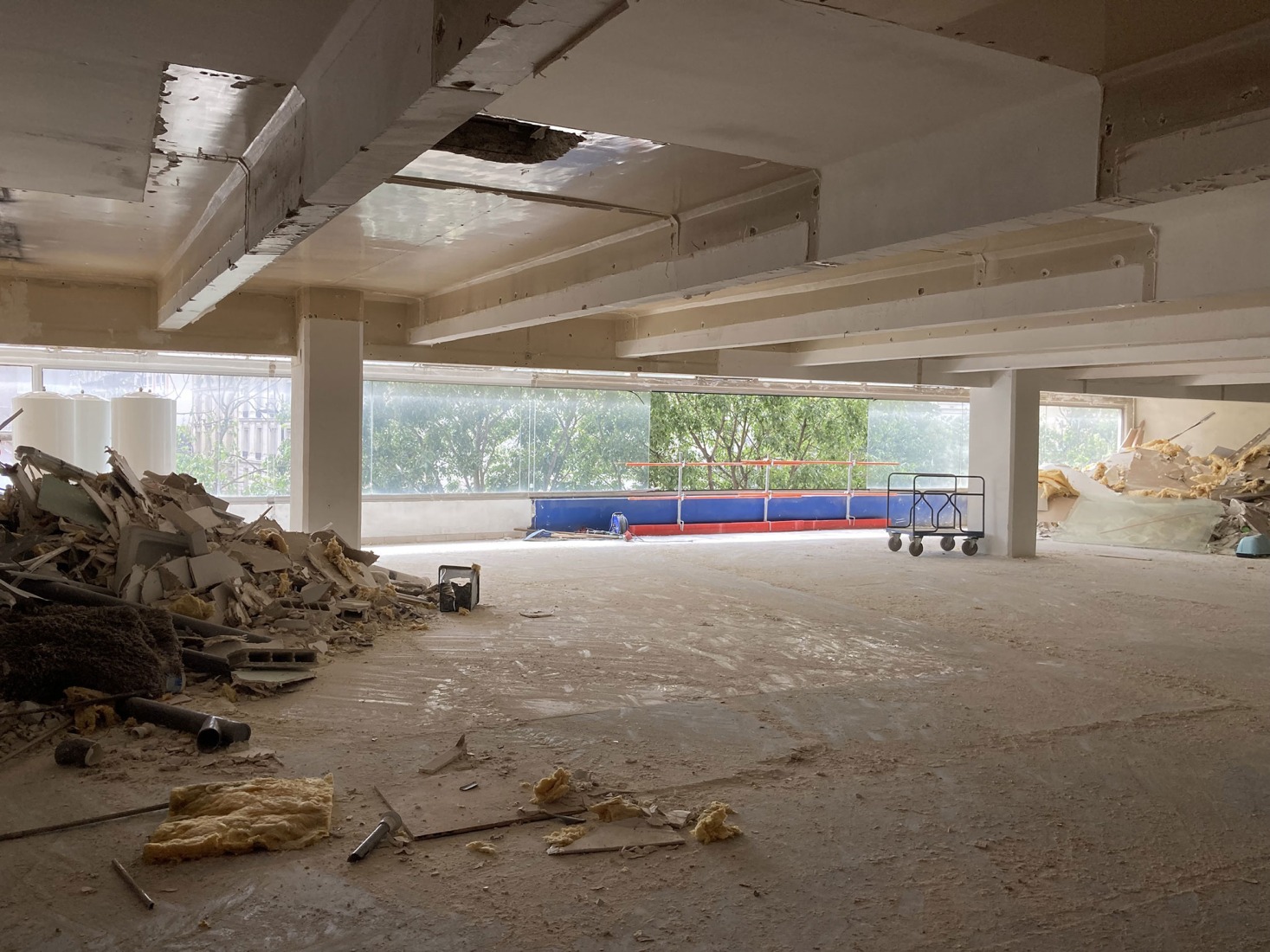The building prior to its reconstruction from a garage into a 63 Apartment Building, by Atelier Tequi Architects. Photograph by Atelier Tequi Architects.