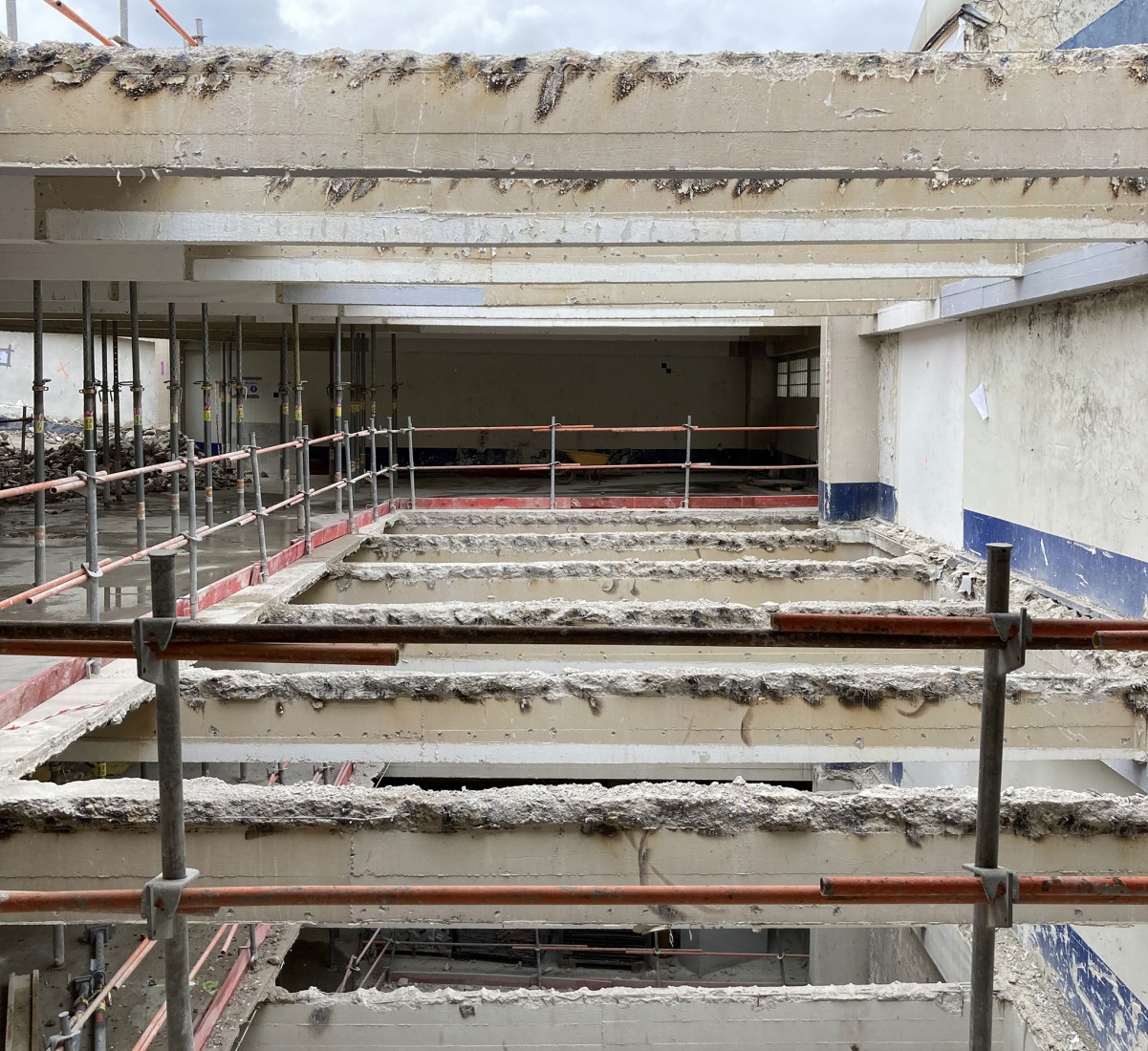 The building prior to its reconstruction from a garage into a 63 Apartment Building, by Atelier Tequi Architects. Photograph by Atelier Tequi Architects.