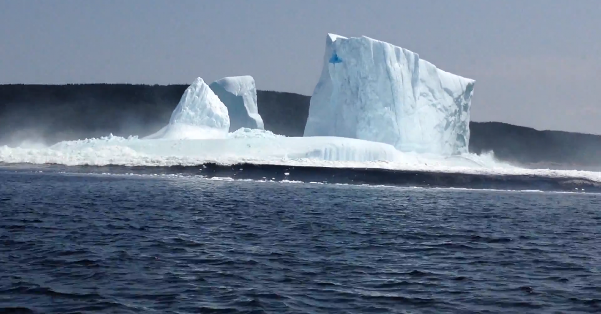 Iceberg collapse in Bay of Exploits, Newfoundland, Canada The