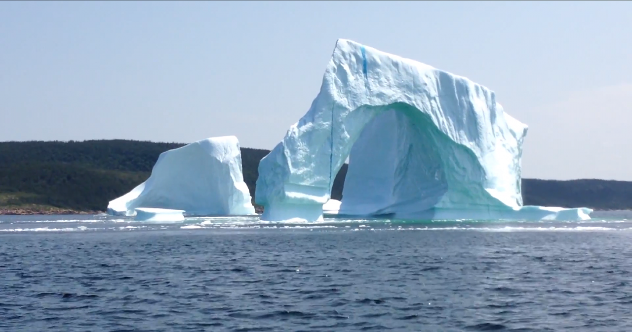 Iceberg collapse in Bay of Exploits, Newfoundland, Canada The