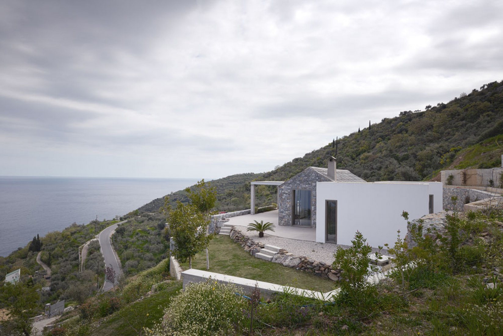 Outside view. Villa Melana by Valia Foufa and Panagiotis Papassotiriou. Photography © Pygmalion Karatzas.