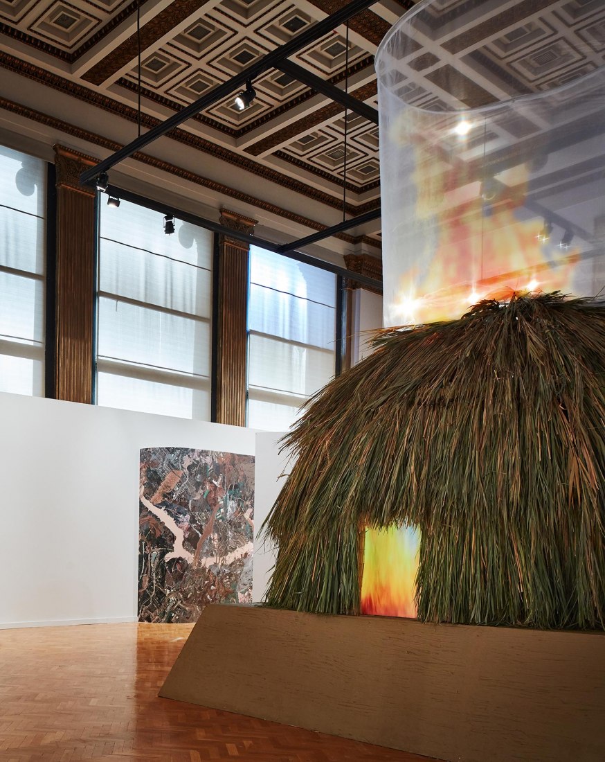 (F) Santiago X (Koasati/ Chamoru) Hayo Tikba (The Fire Inside)​, 2019. (B) Carolina Caycedo The Collapsing of a Model​, 2019. Courtesy of Chicago Architecture Biennial​ / KendallMcCaugherty,​ ​2019.
